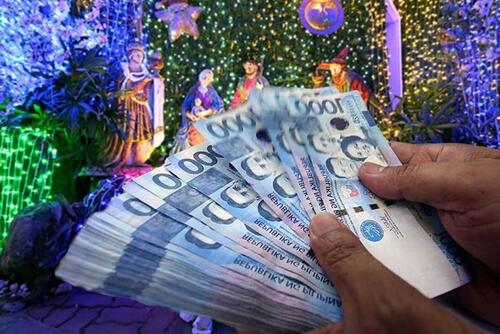 A stack of Philippine Peso bills, relating to Christmas.