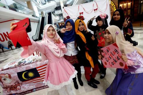 Muslim women cosplayers taking a wefie during an event at a mall in Petaling Jaya, near Kuala Lumpur, in July. Marketing trend and research outfit J. Walter Thompson’s Innovation Group’s report The New Muslimah: South-East Asia Focus shows more than half of Malaysian women aged 18 to 39 said a career is important to them, with 80 per cent putting education first